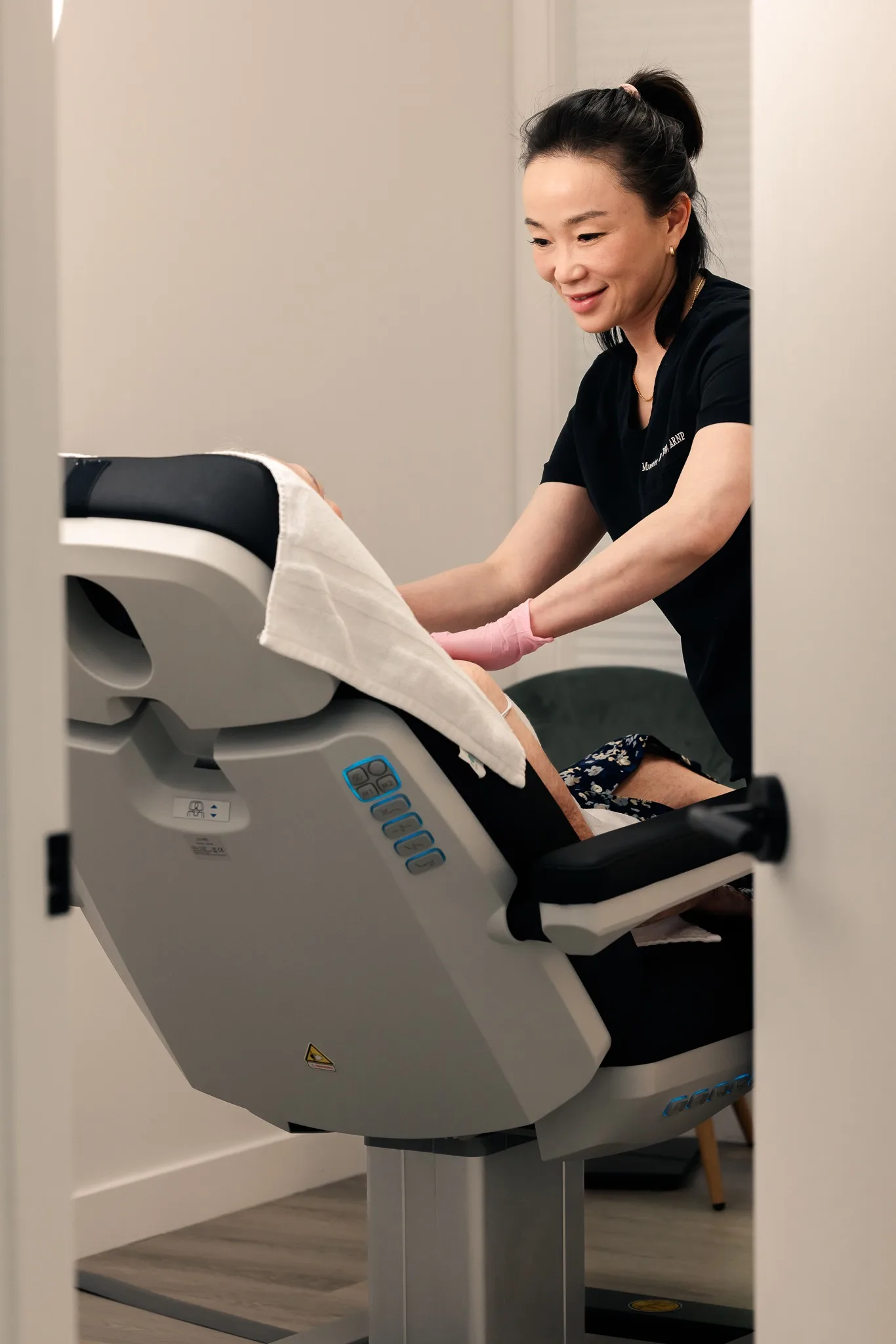 Medical aesthetics practitioner caring for a client during a treatment