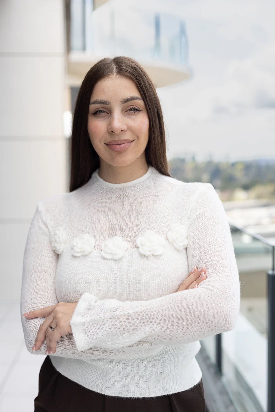 Bright office portrait in a white sweater