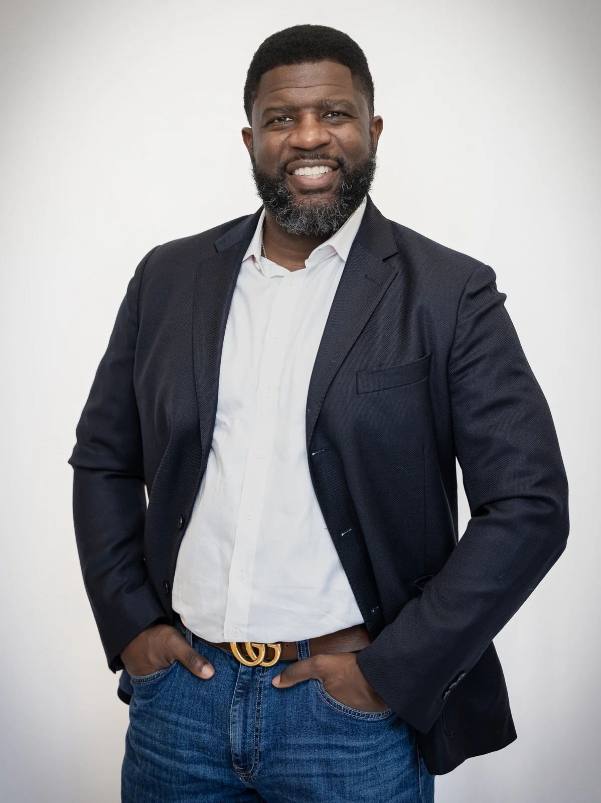 Full-length business portrait in a navy blazer