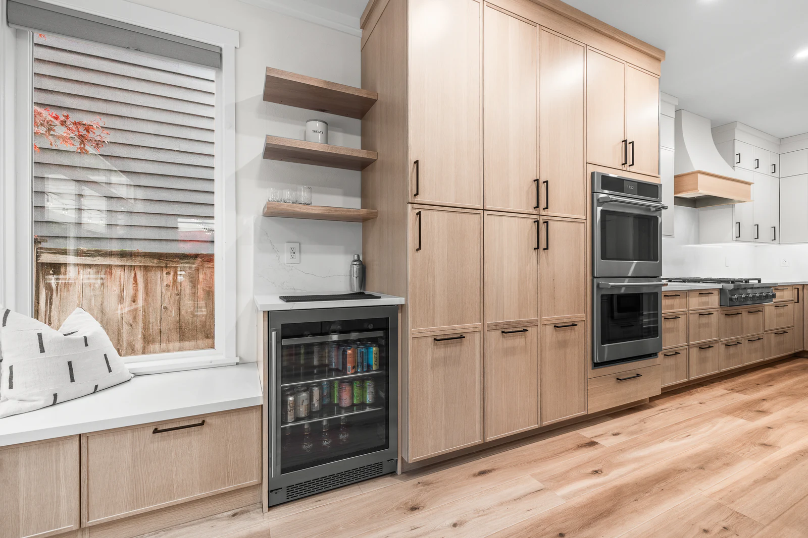Custom kitchen cabinetry with a built-in beverage cooler