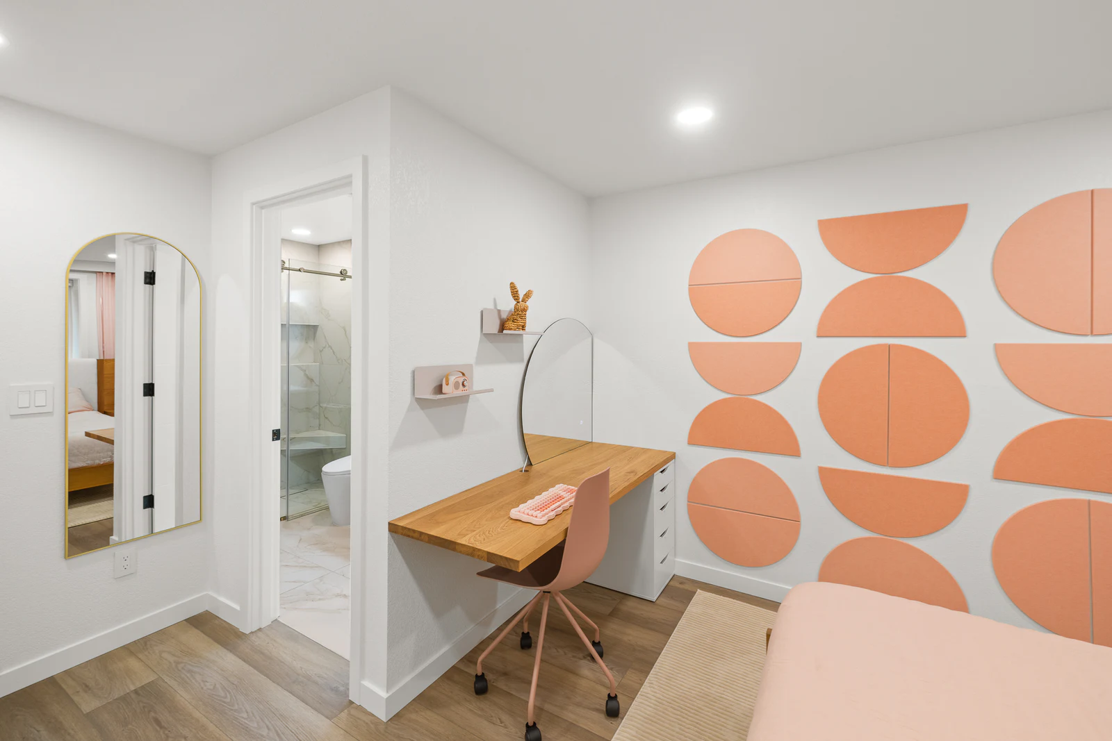 Home office with a geometric coral accent wall