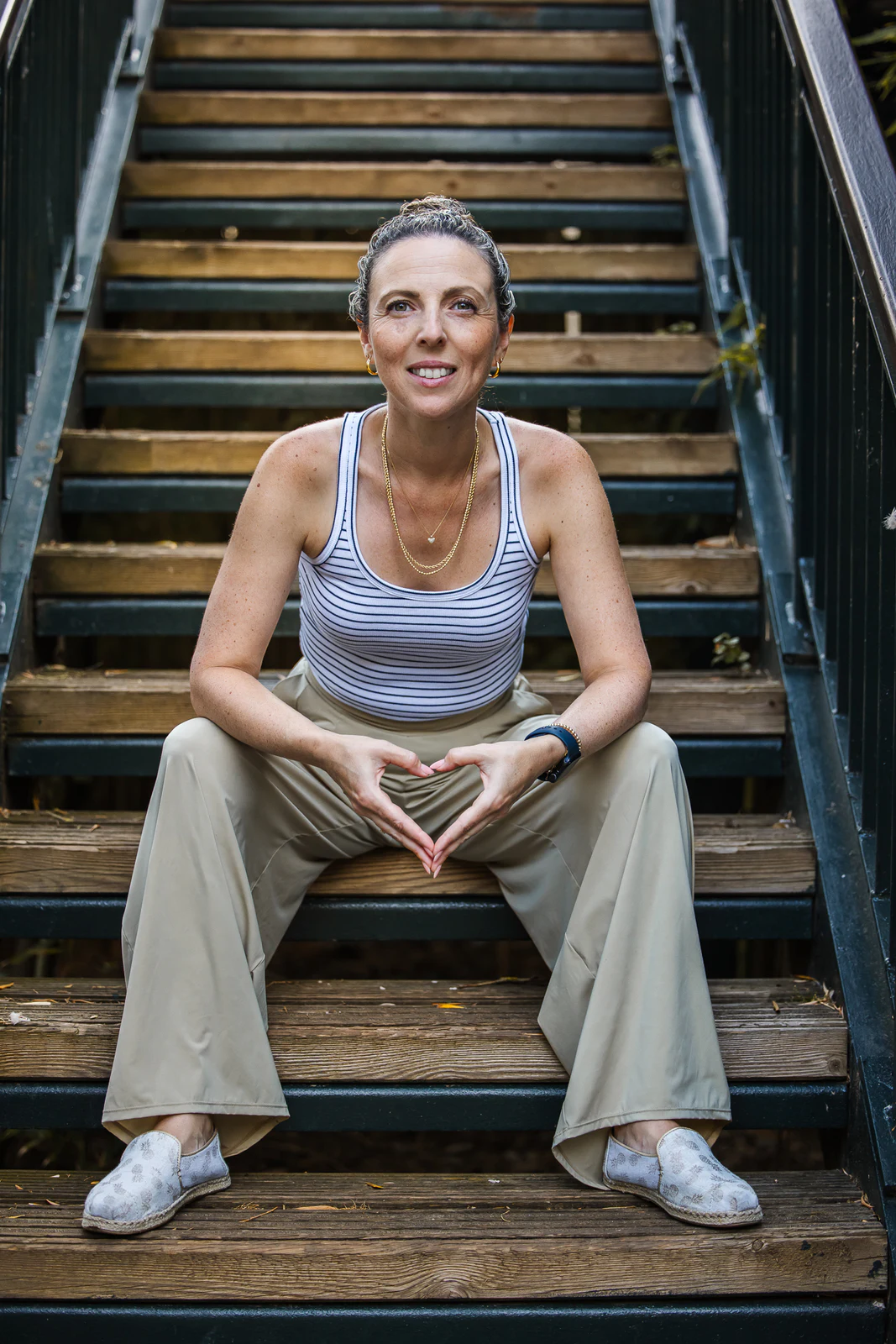 Relaxed portrait seated on an outdoor staircase