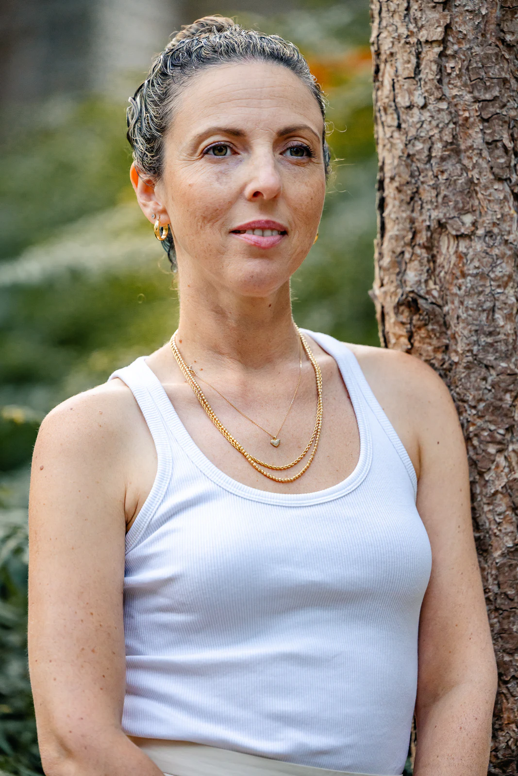 Natural-light portrait beside a tree