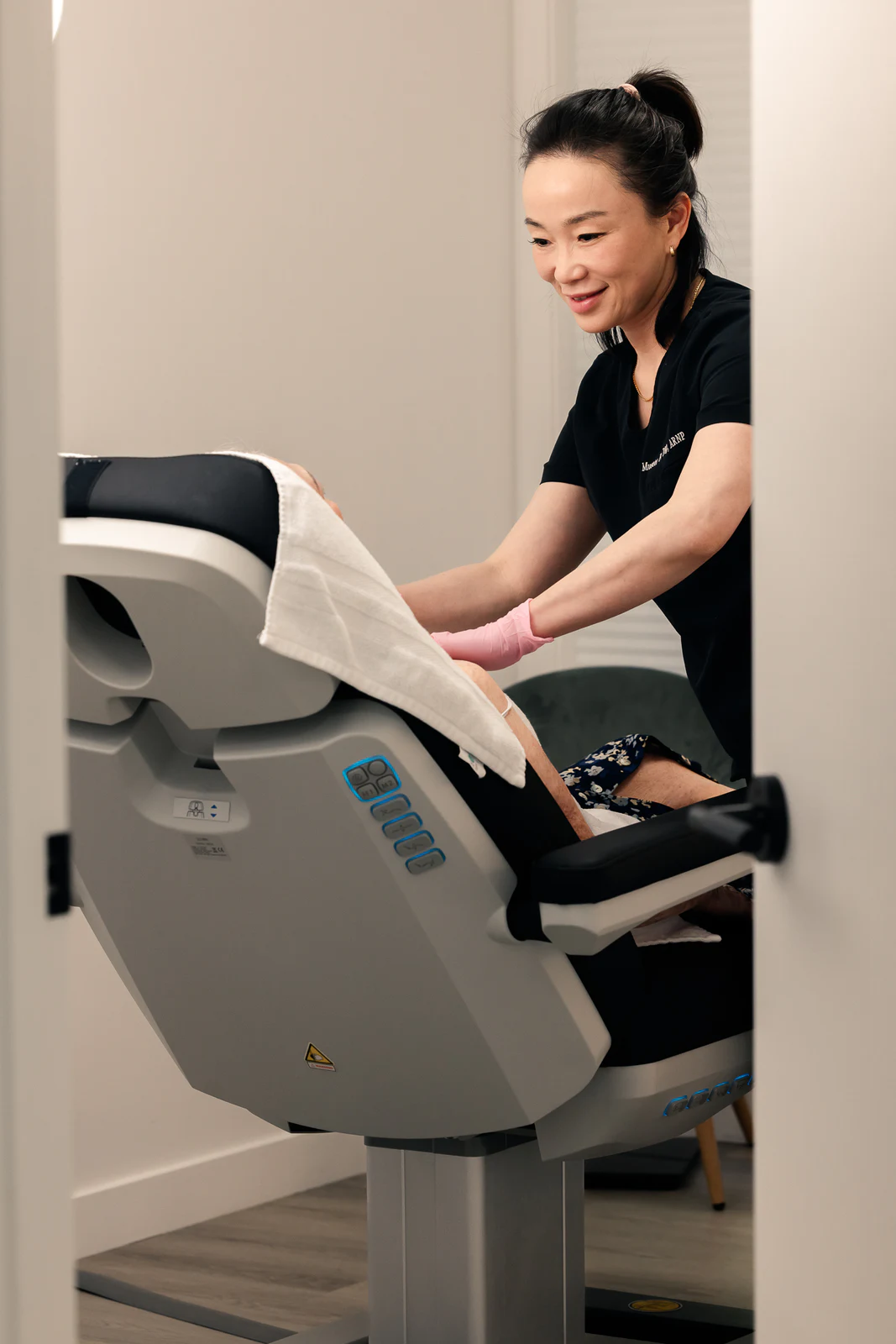 Practitioner preparing treatment equipment