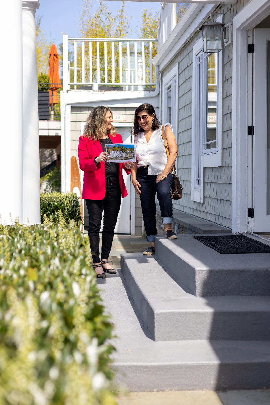 Two professionals walking together after a consultation